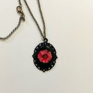 Bright pink Aster flower in resin black bezel